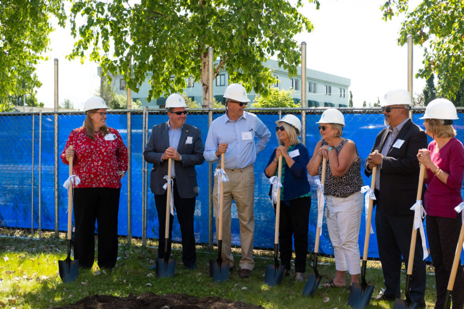 Funders and CHA Executive Director Alison Kear standing with shovels at Breaking Ground ceremony