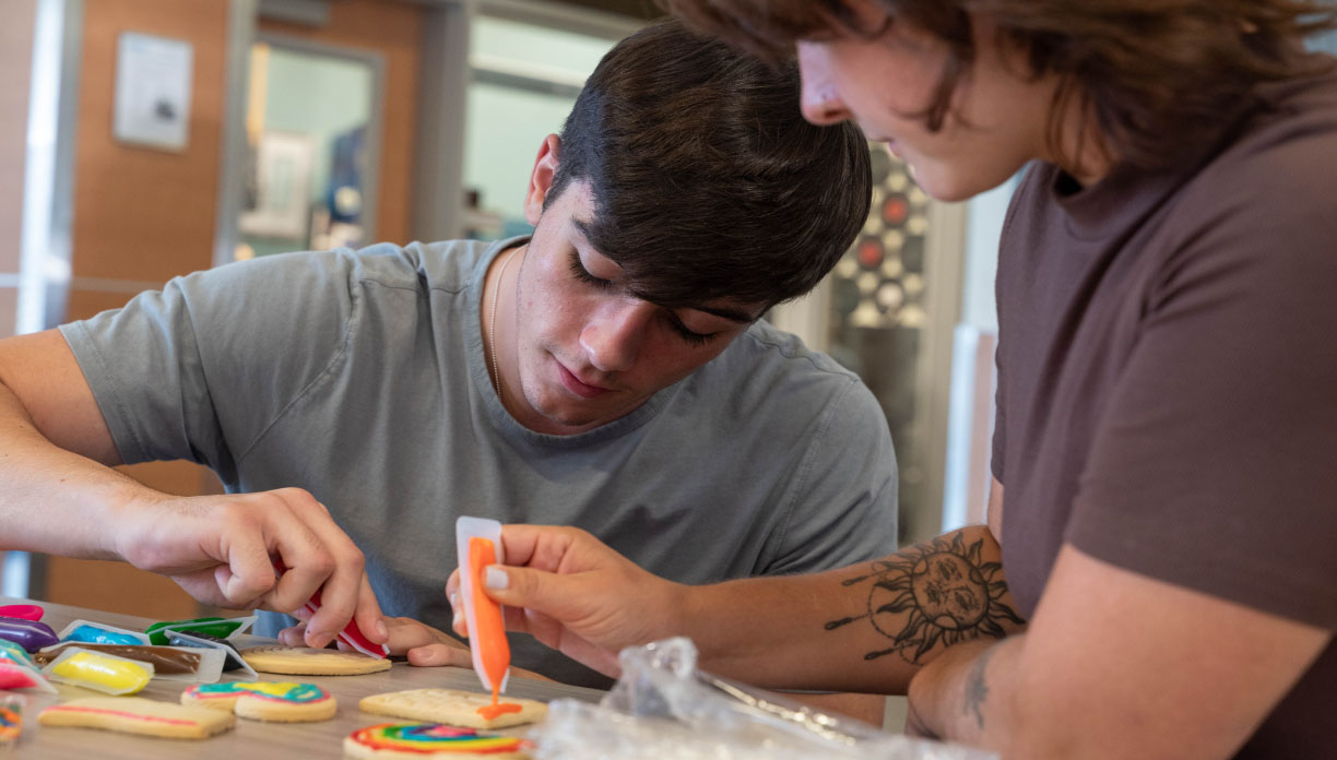 Youths decorating cookies
