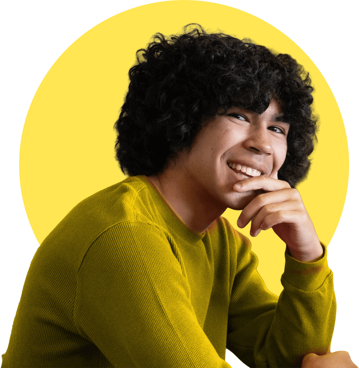 Young man with curly hair smiling