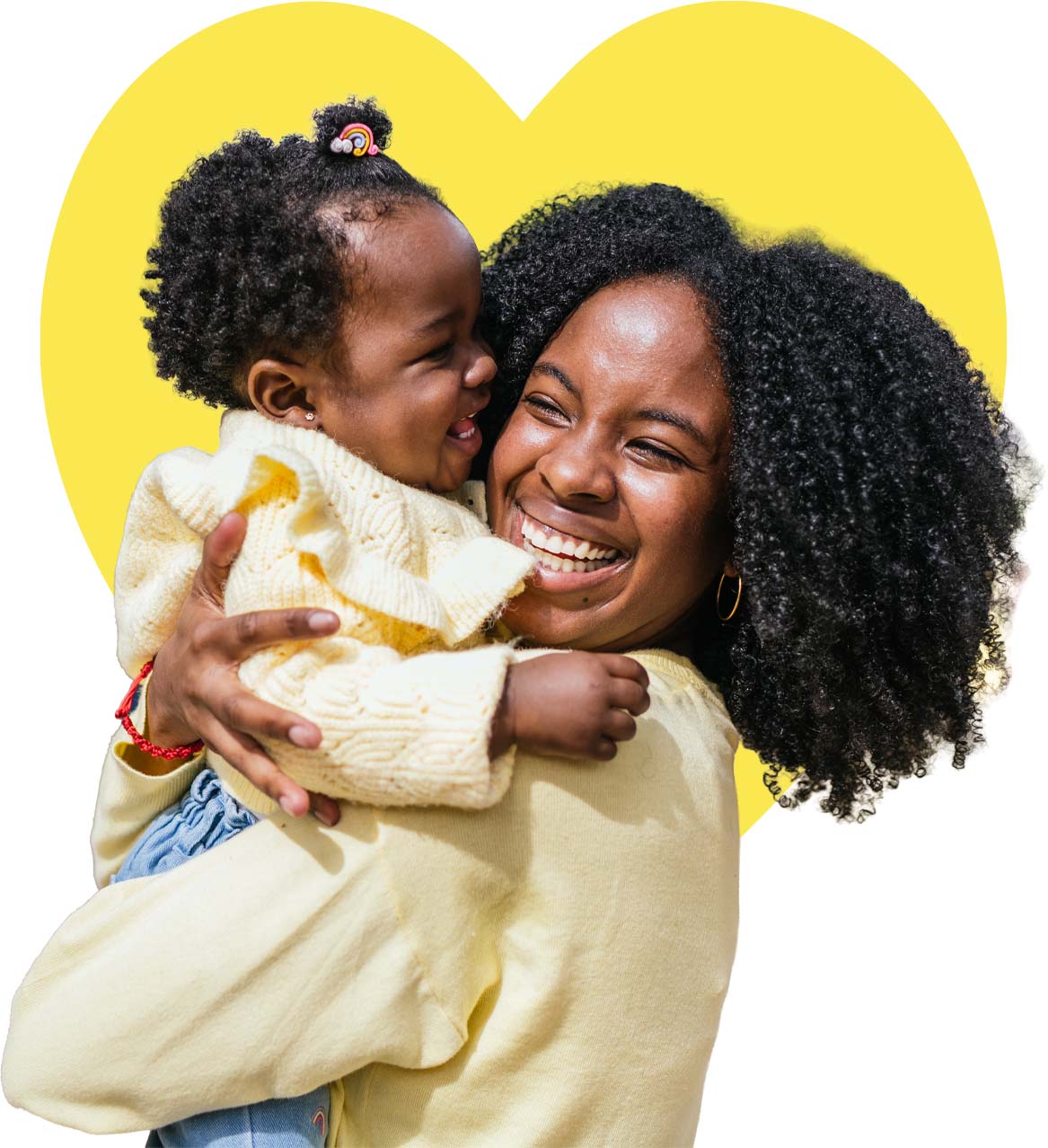 A young mother wearing a plaid shirt looking at the camera.